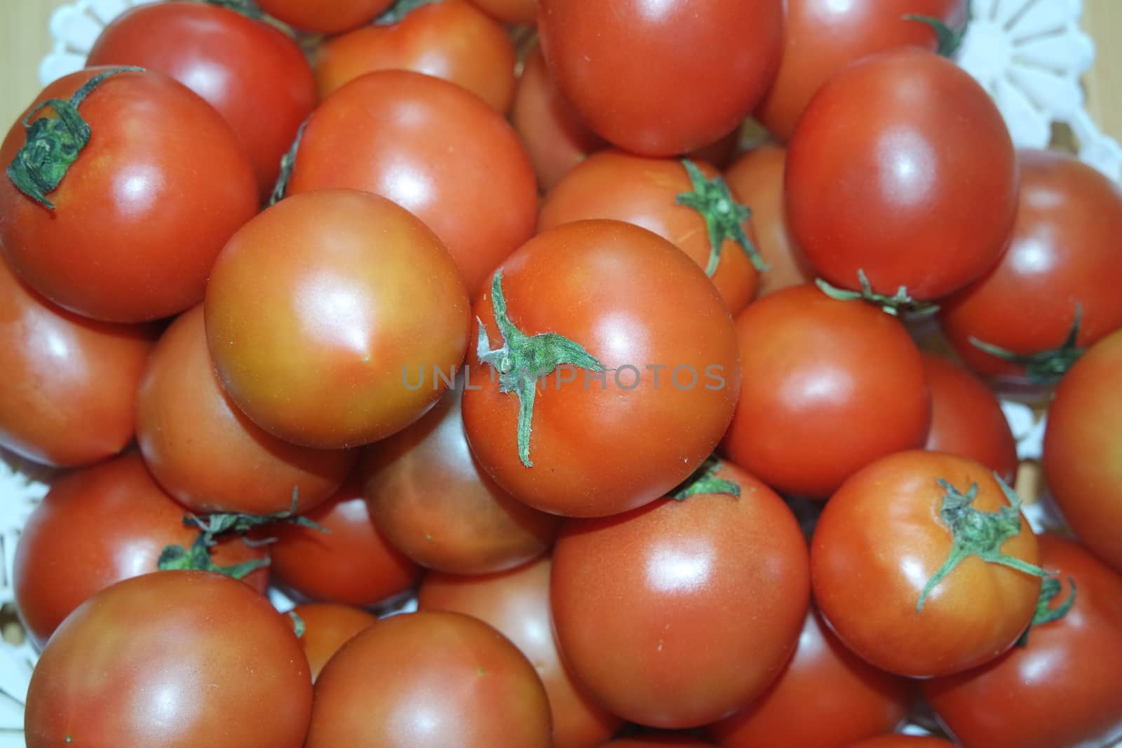 Close-up view of red tomatoes in market for sale. A fruit background for text and advertisements