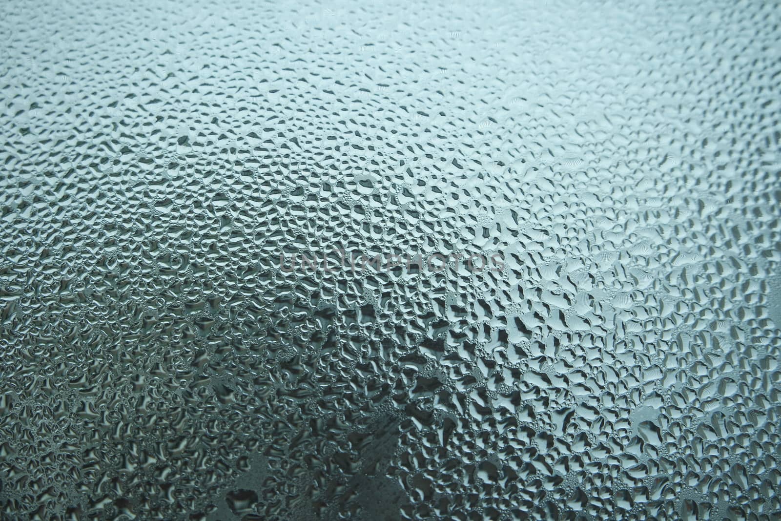 Bright grey color glassy texture, with water drops on it. Water drop glassy background