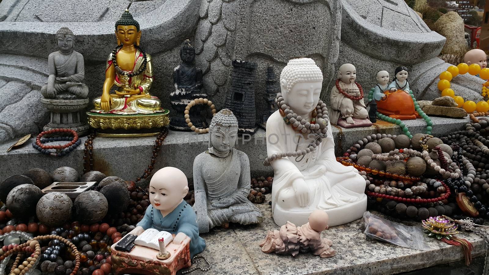 Closeup view of statues of religious monks. Buddha mini statue with beautiful background