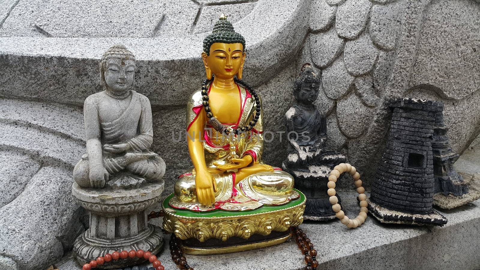 Closeup view of statues of religious monks. Buddha mini statue with beautiful background