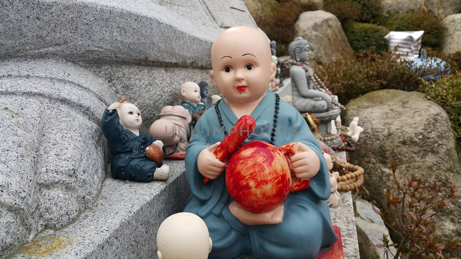 Closeup view of statues of religious monks. Buddha mini statue with beautiful background