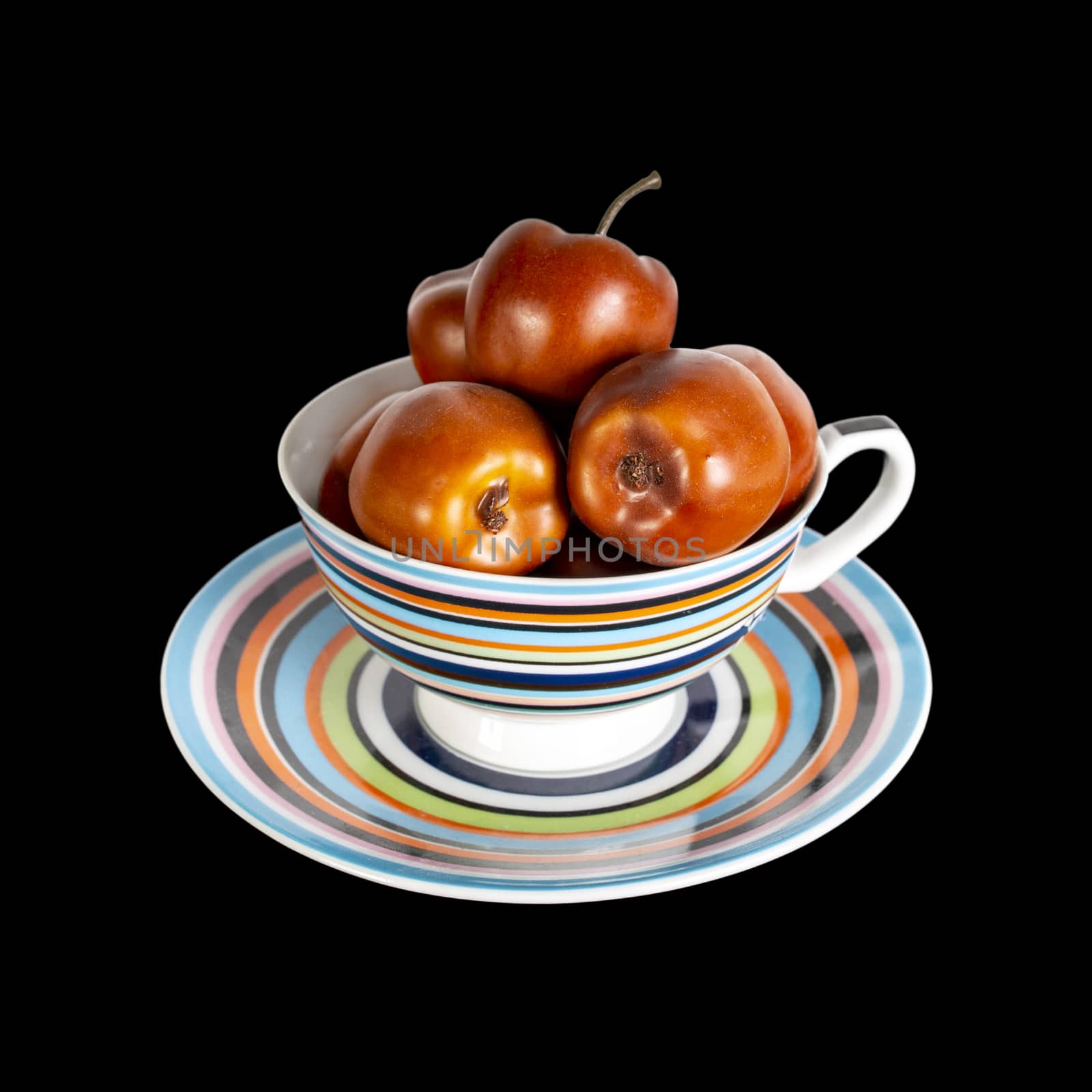 apples are beautifully stacked in a multi-colored cup on a saucer. by 977_ReX_977