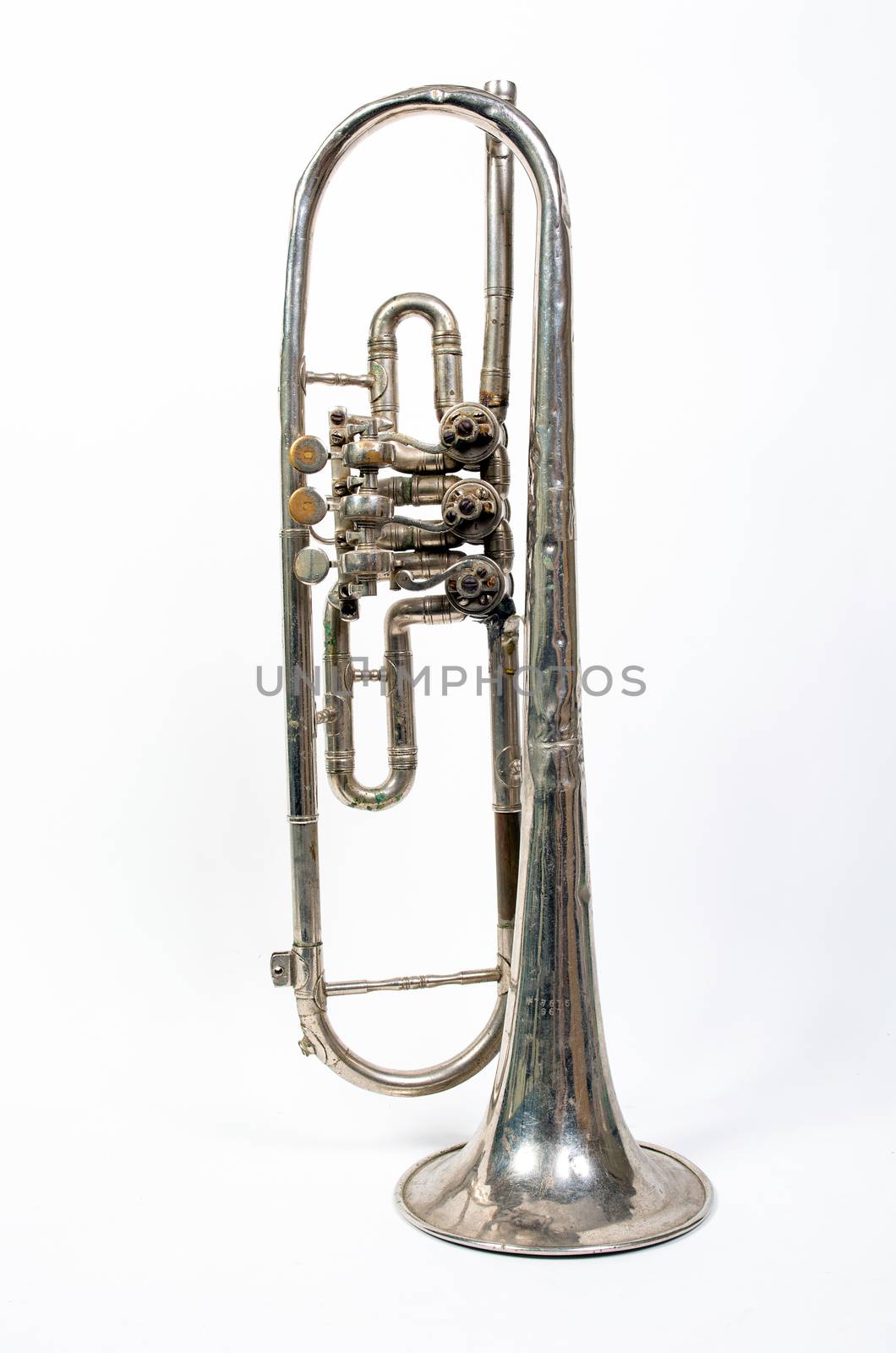 silver trumpet old isolated on a white background. Musical instrument worth