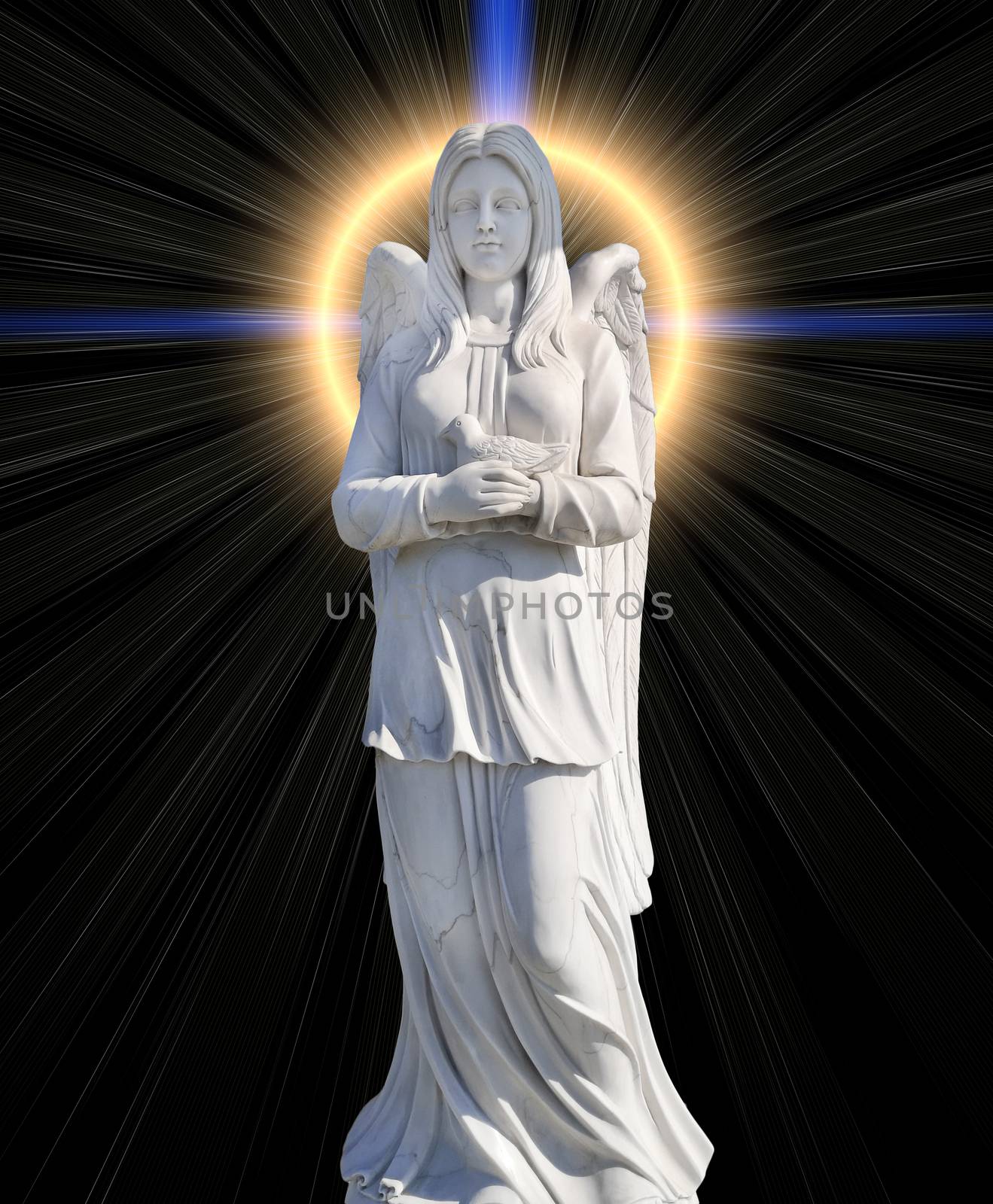 The cemetery monument in the form of an angel of white on a background of mystical light in the form of a cross