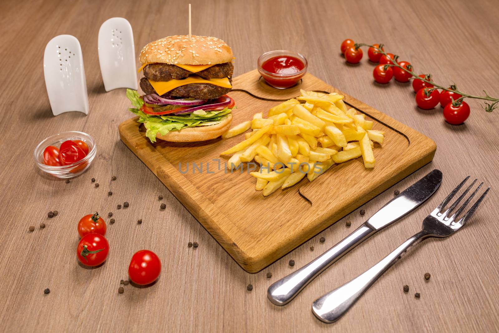 Double veal cheeseburger a wooden board. ketchup by 977_ReX_977