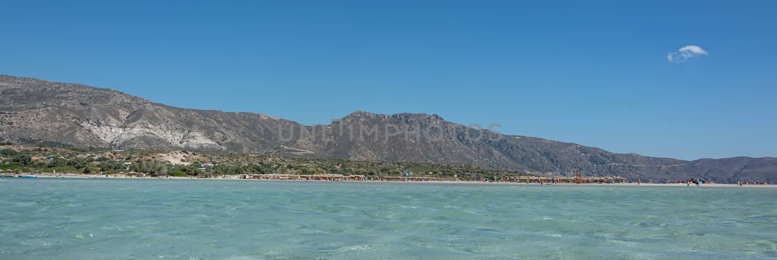 Seascape. The beach on the seafront in a mountainous area by Grommik