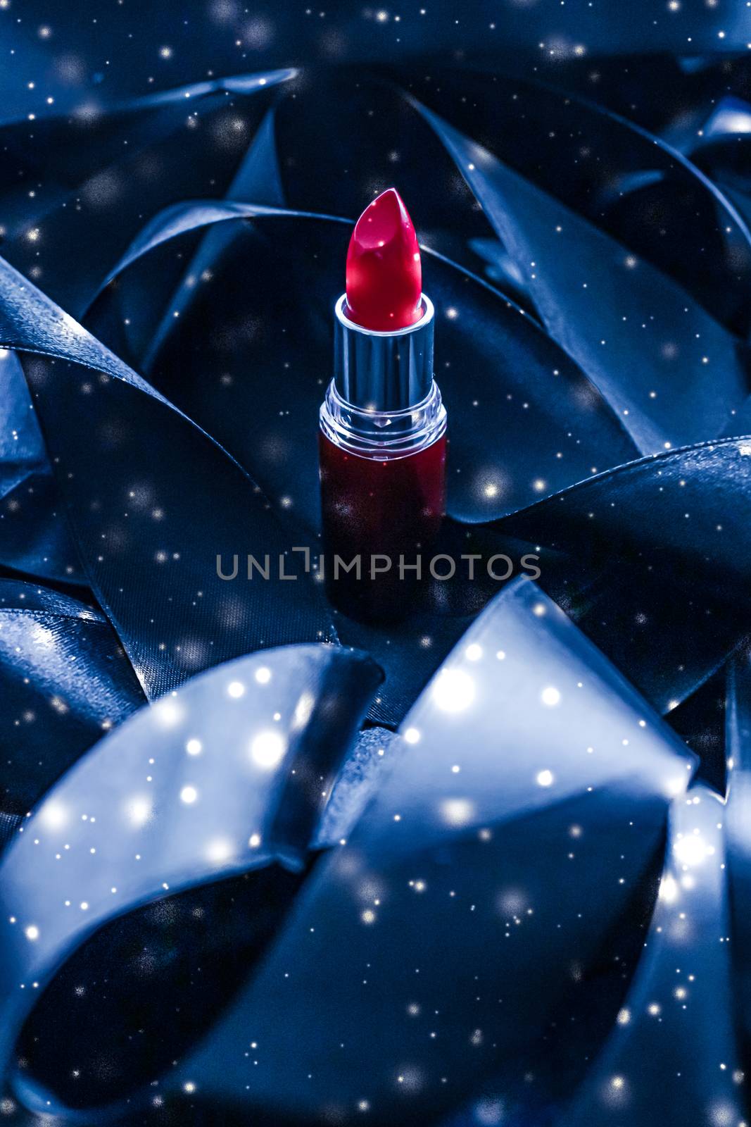 Red lipstick on blue silk and shiny glitter background, luxury make-up and beauty cosmetic by Anneleven