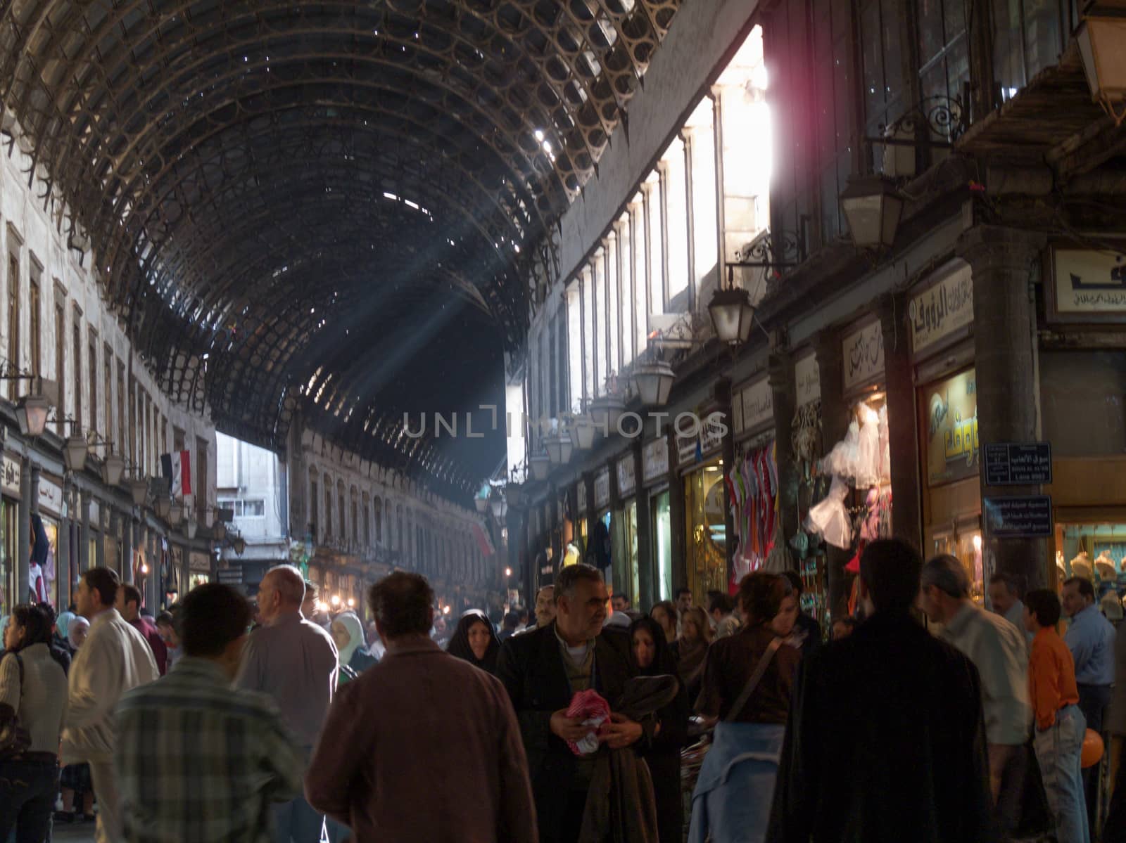 The Al-Hamidiyah Souq, Damascus Syria 04/12/2009 the main market in the Old City. All goods, foods, clothes, jewelry were on sale here.Before the war this was the busiest souk in Syria with the Umaayad Mosque at one end. Famous for it's arched tin roof. High quality photo