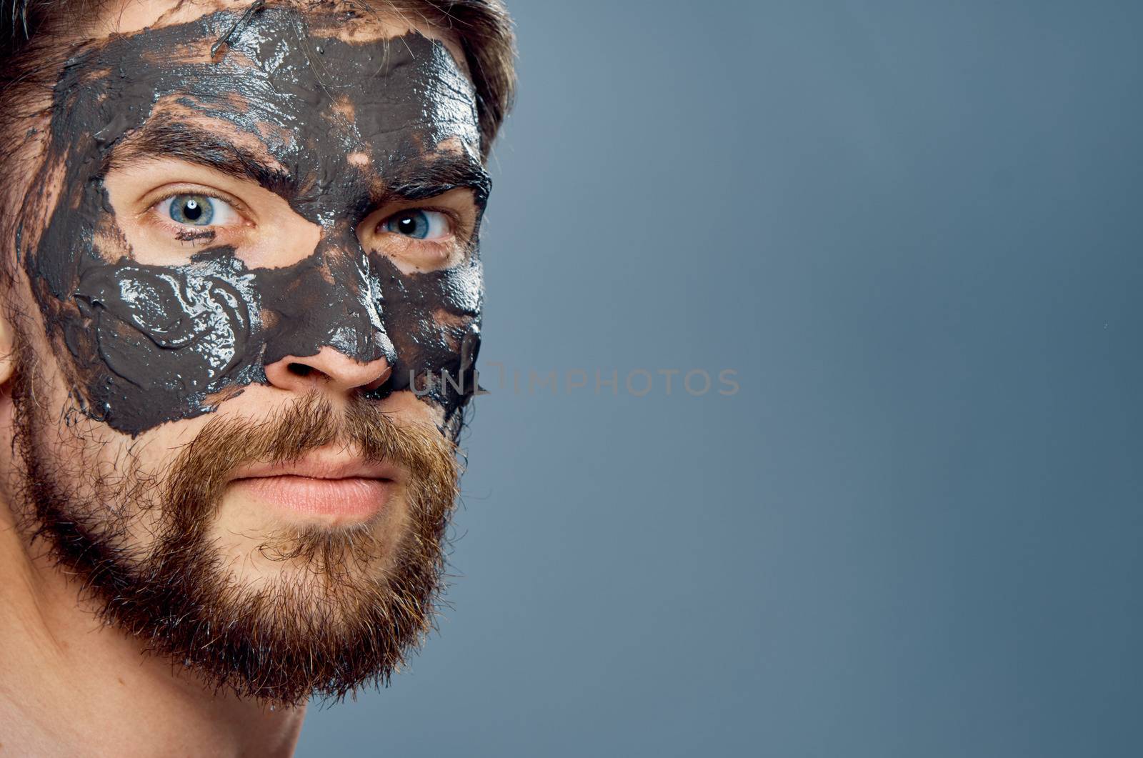 Man in black mask on face clean skin lifestyle naked shoulders hygiene health by SHOTPRIME