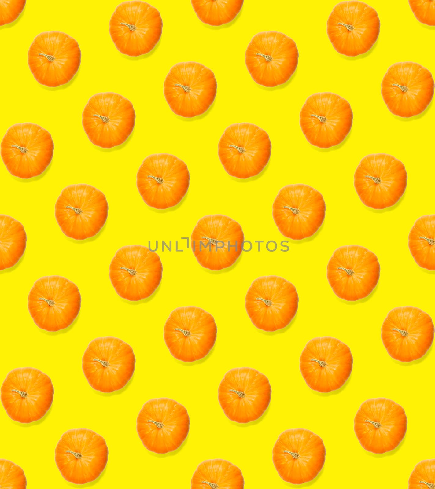 Seamless pattern with pumpkin. Pumpkin quality pattern. Autumn abstract seamless pattern made from Pumpkins on the yellow background.