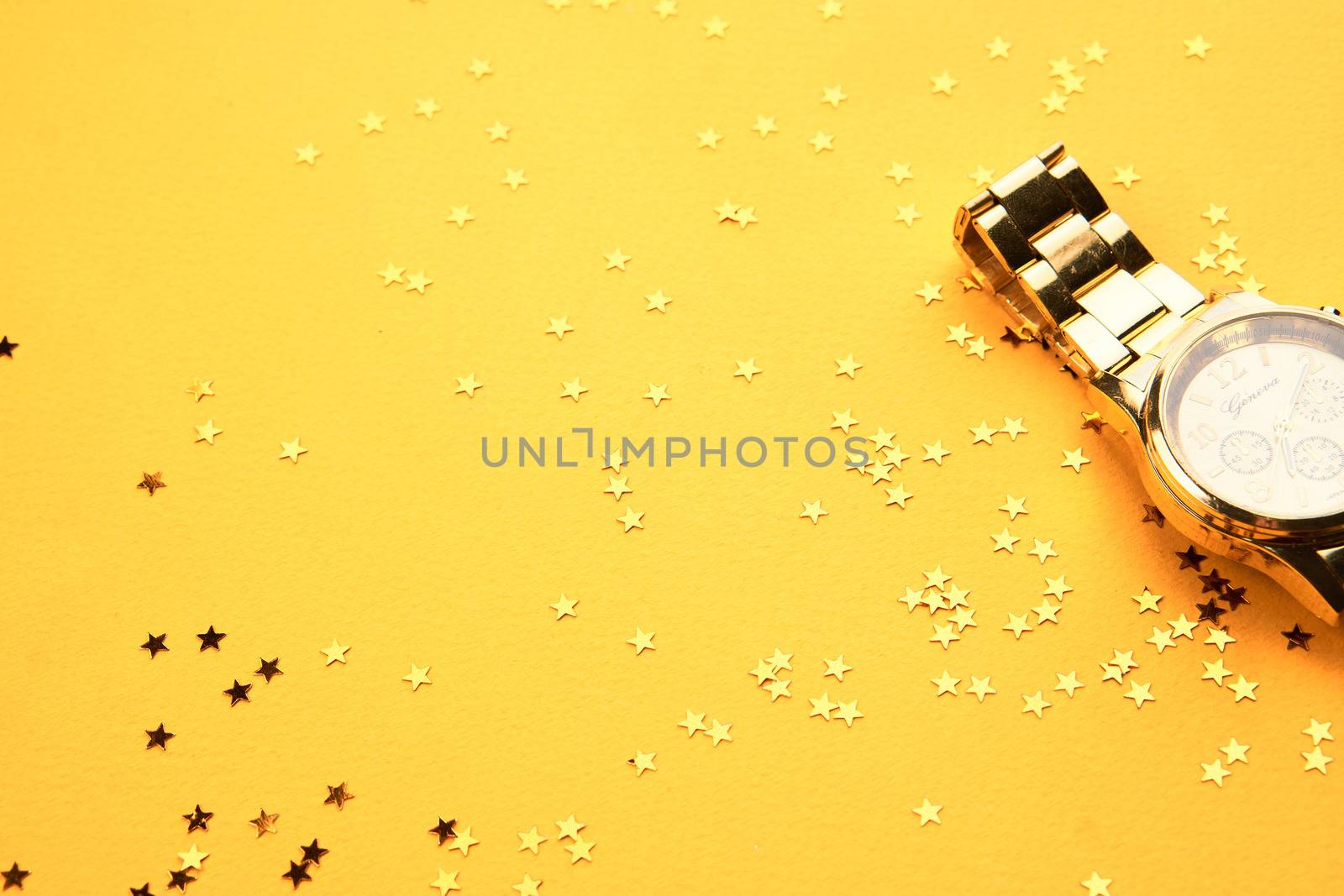 Wristwatch on yellow background and Copy Space glitter by SHOTPRIME