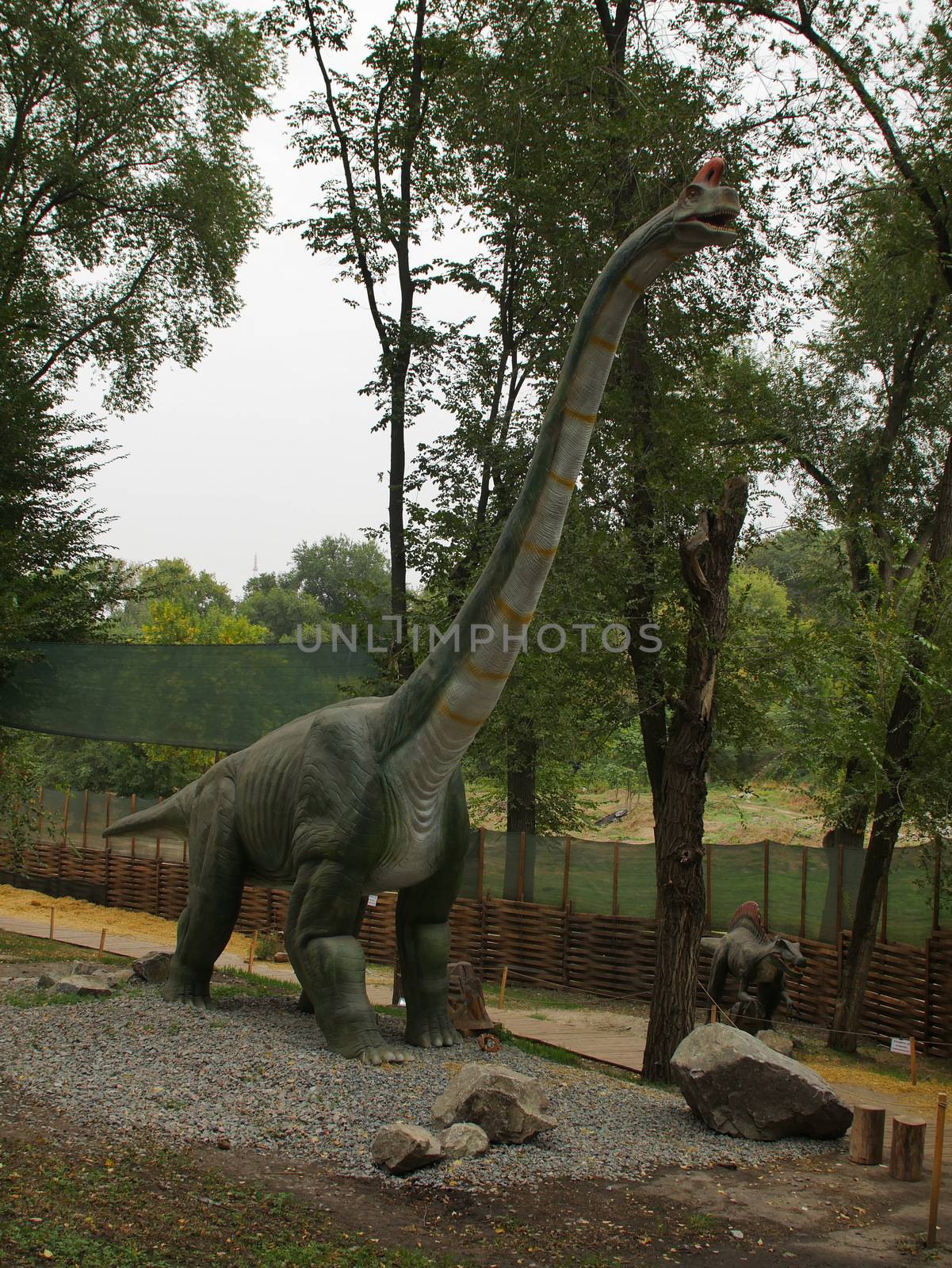 Dinosaurs figures in local autumn park, Ukraine