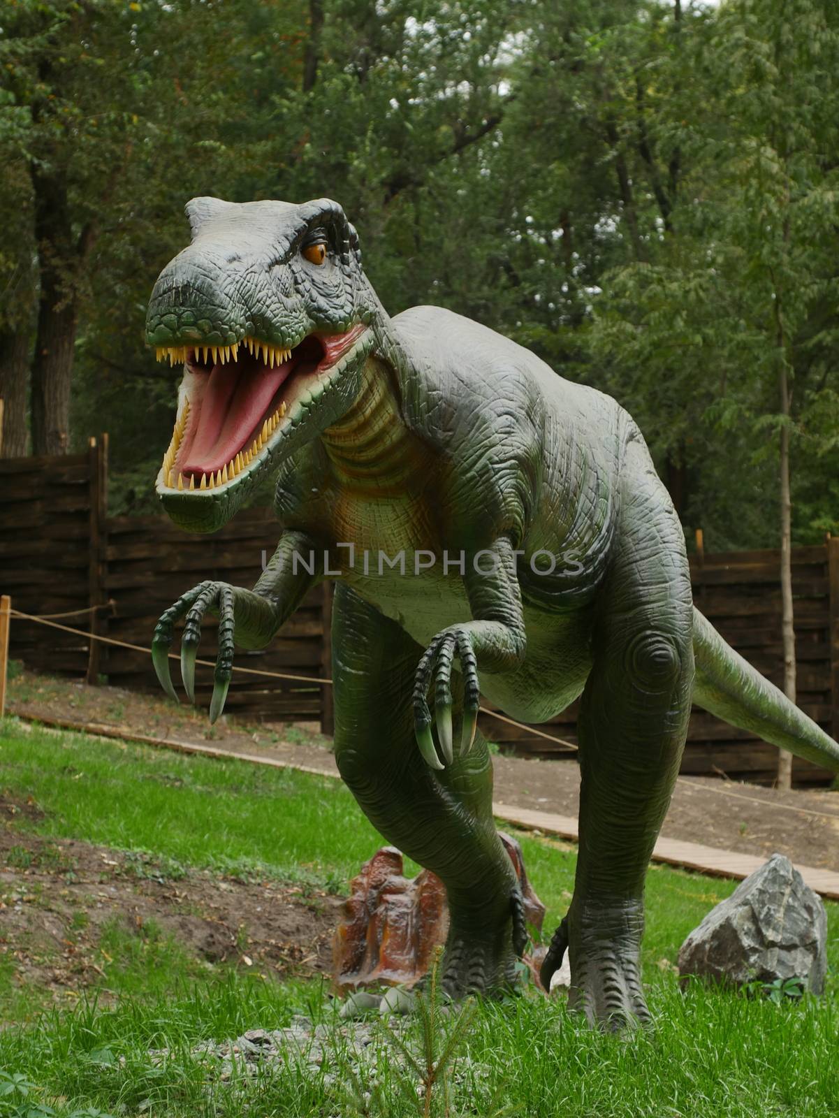 Dinosaurs figures in local autumn park, Ukraine