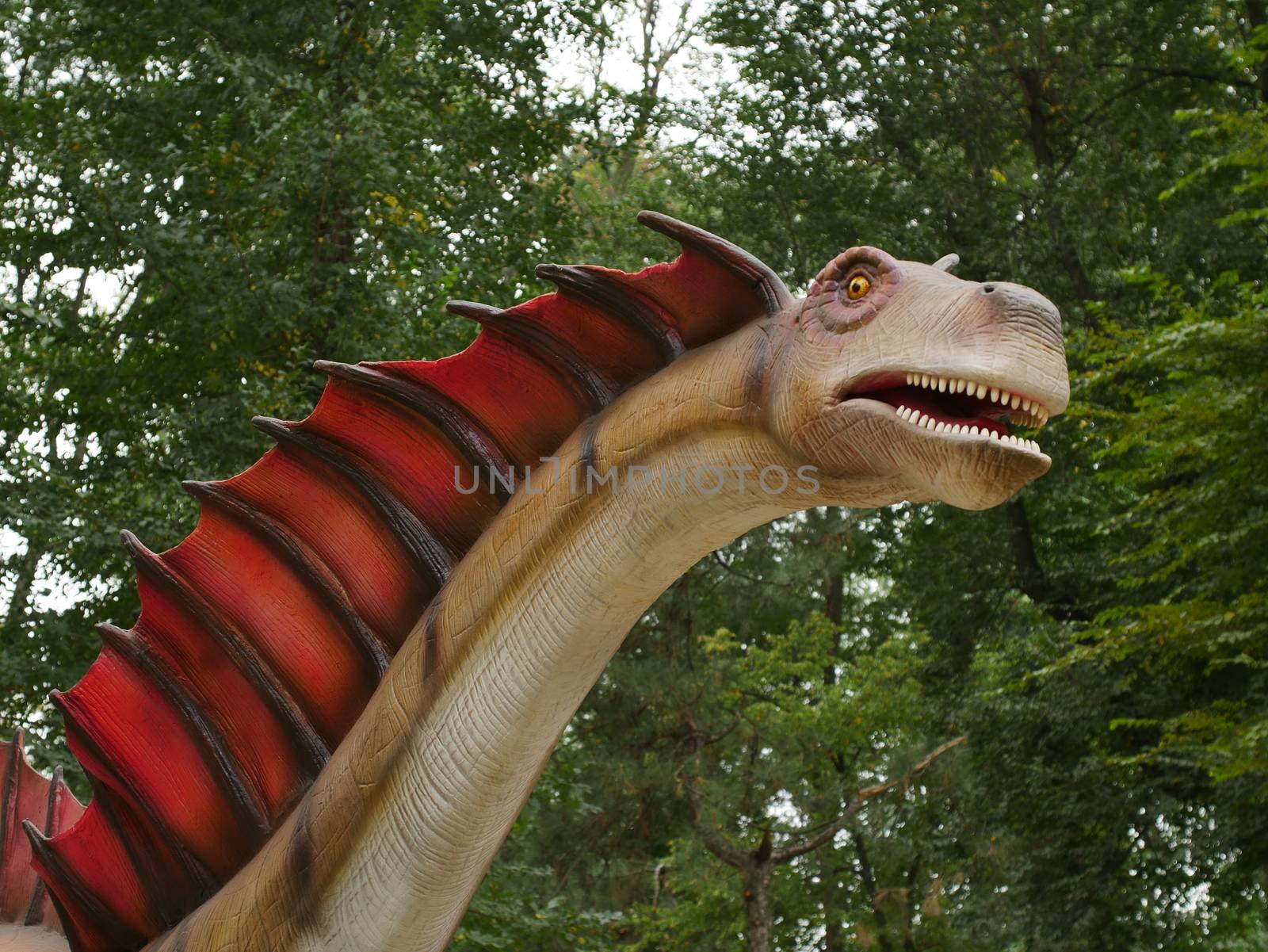 Dinosaurs figures in local autumn park, Ukraine