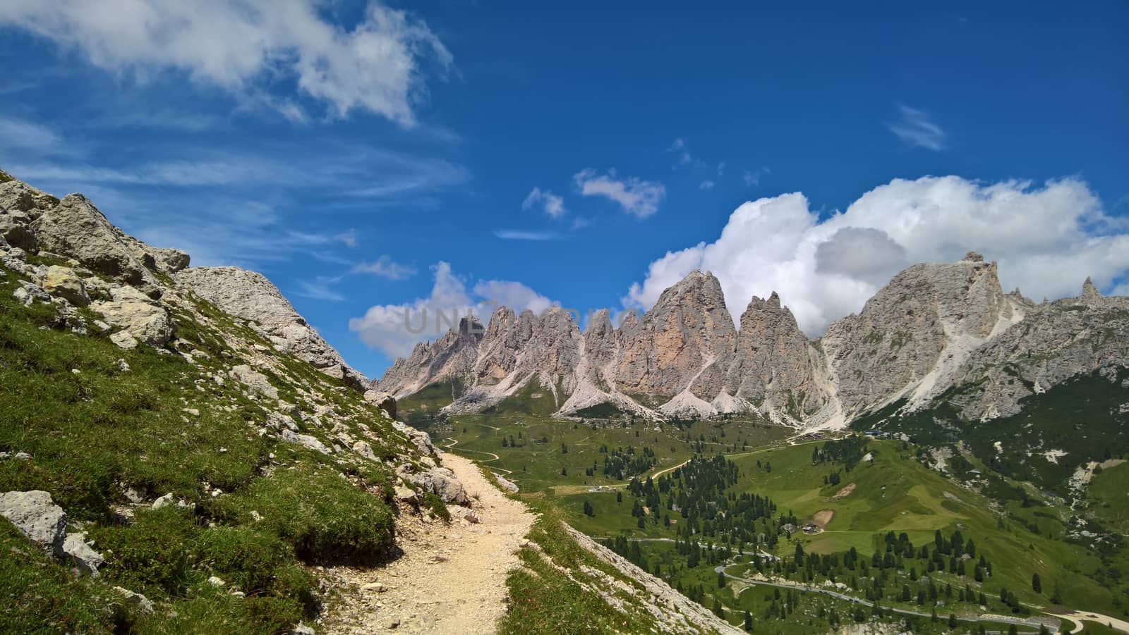 Val Gardena, Italy - 09/15/2020: Scenic alpine place with magical Dolomites mountains in background, amazing clouds and blue sky in Trentino Alto Adige region, Italy, Europe