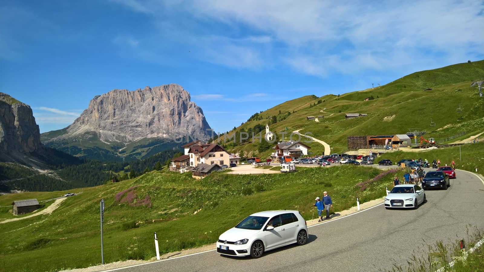 Val Gardena, Italy - 09/15/2020: Scenic alpine place with magical Dolomites mountains in background, amazing clouds and blue sky in Trentino Alto Adige region, Italy, Europe