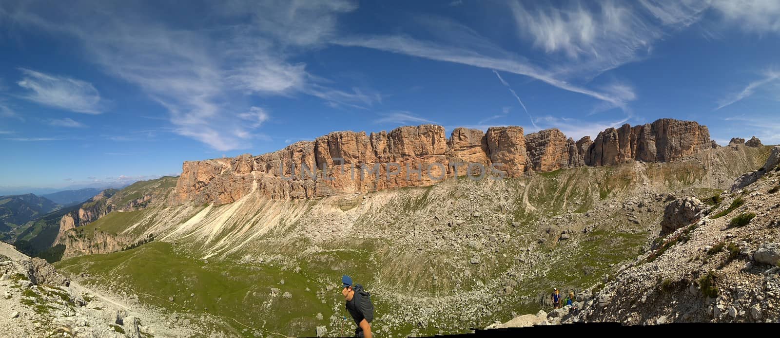 Val Gardena, Italy - 09/15/2020: Scenic alpine place with magical Dolomites mountains in background, amazing clouds and blue sky in Trentino Alto Adige region, Italy, Europe