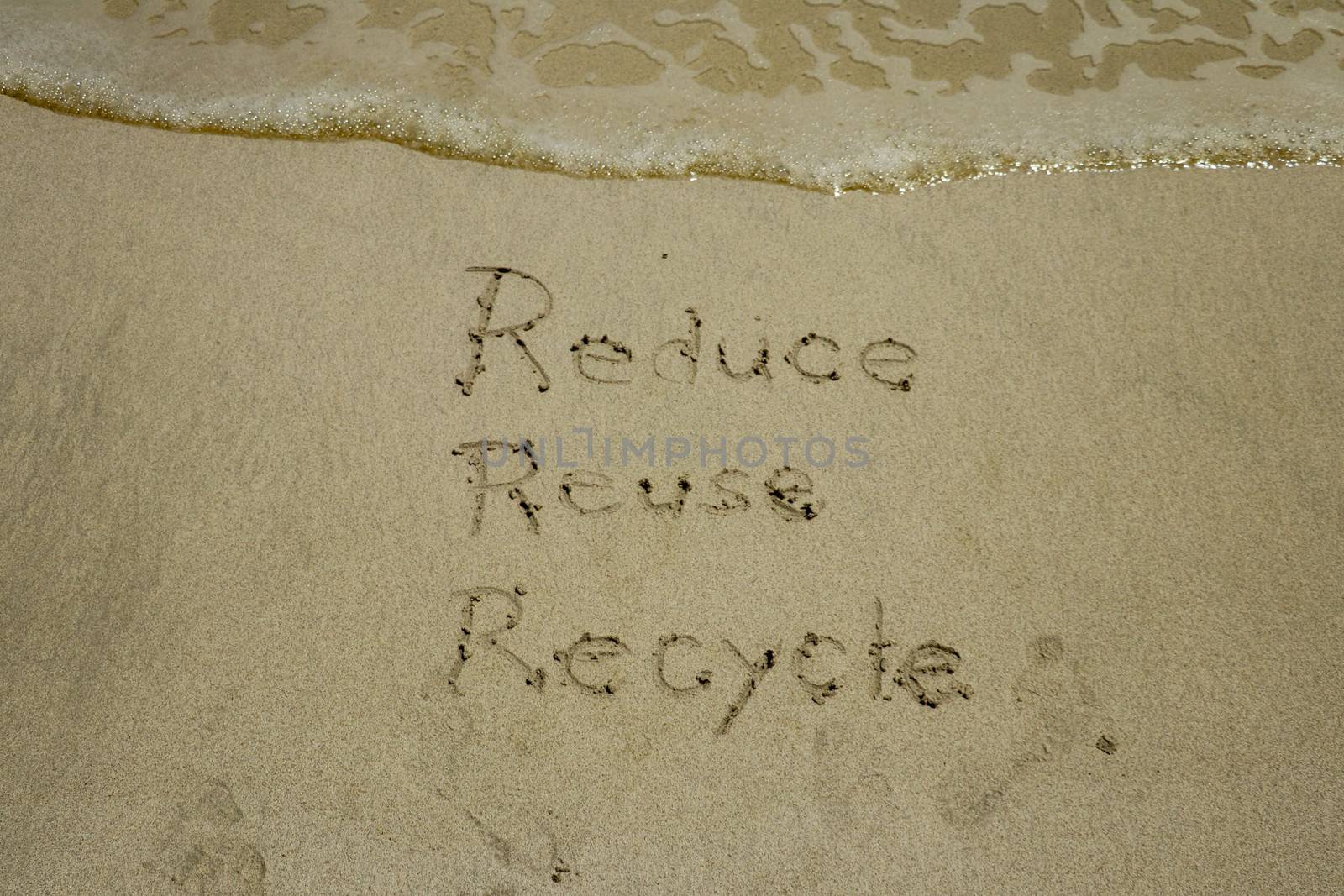 reduce reuse recycle concept drawn on sand, sustainability by Sanatana2008