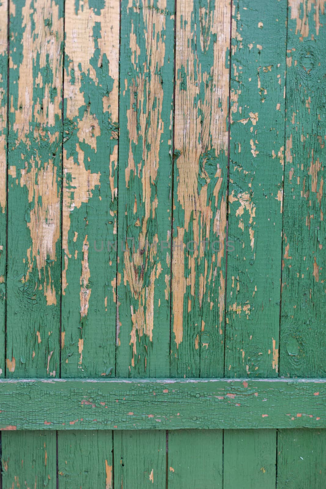 Dark green scratched grunge Wooden textured wall. Old wood texture with peeling paint.