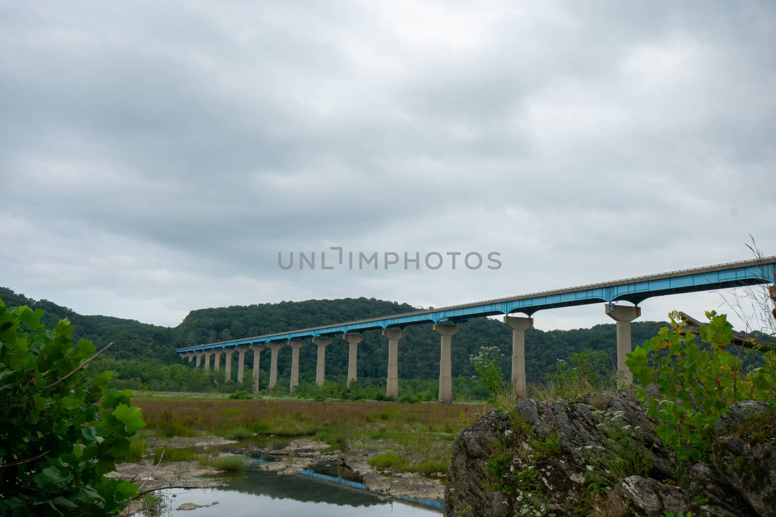 The Norman Wood Bridge Over the Susquehanna River on a Cloudy Sk by bju12290