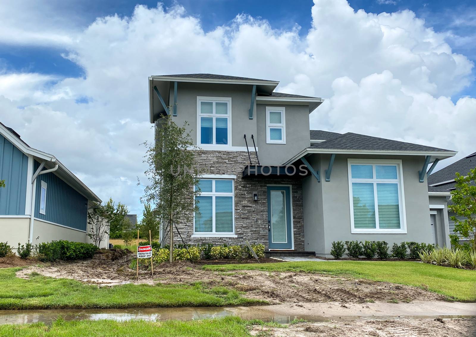 A home with a sign in front that warns people to keep out due to by Jshanebutt