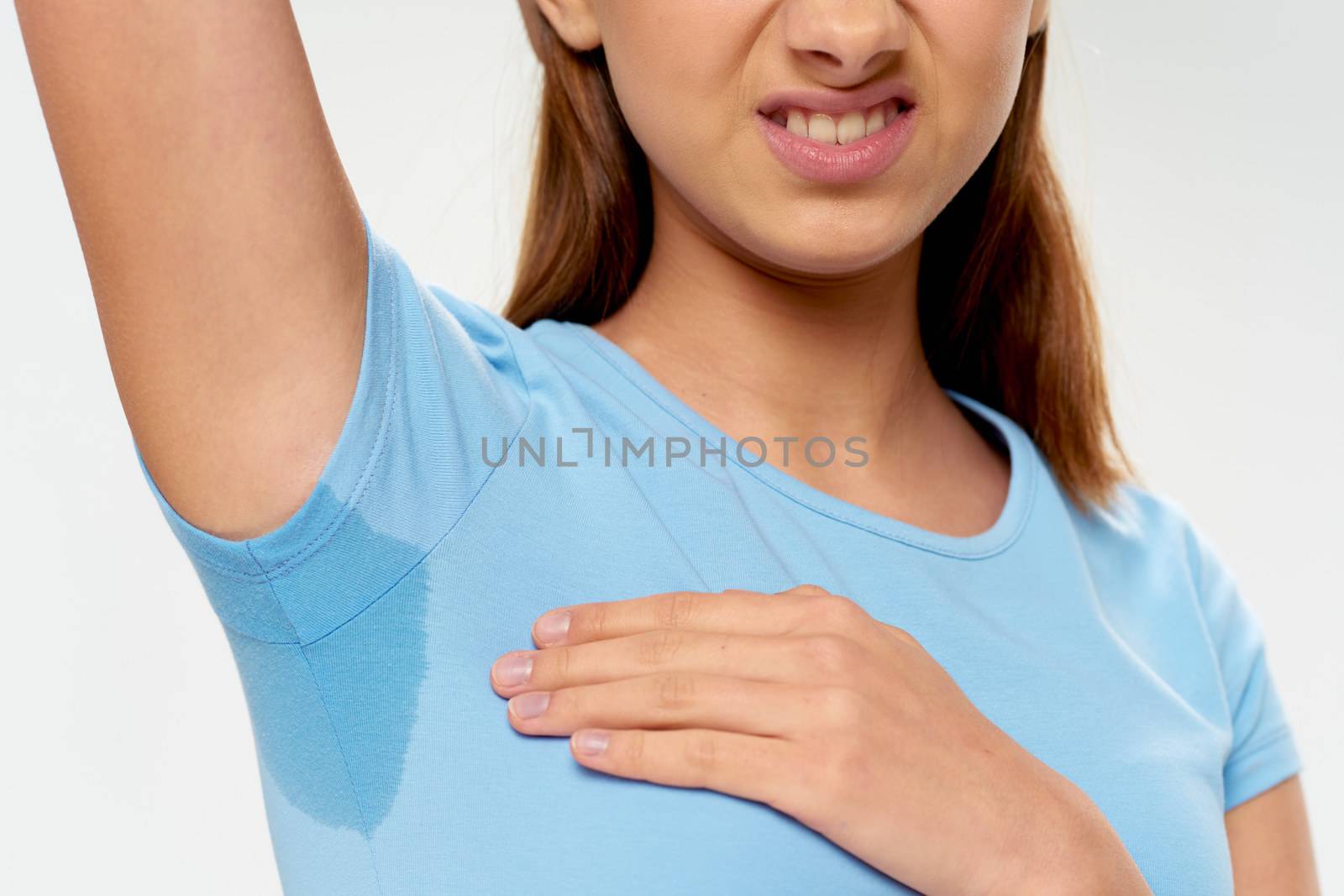Girl with a wet shirt negative gesture armpit smell health by SHOTPRIME