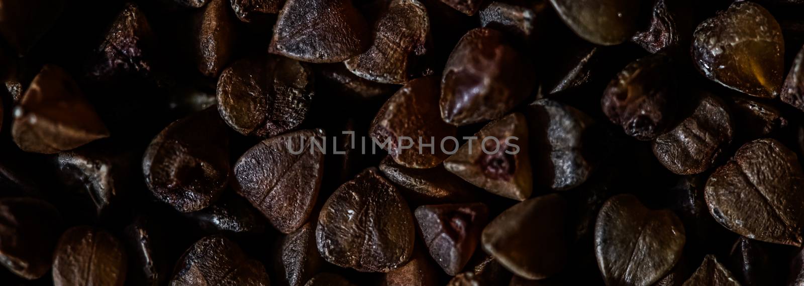 Buckwheat grain closeup, food texture and cook book background by Anneleven