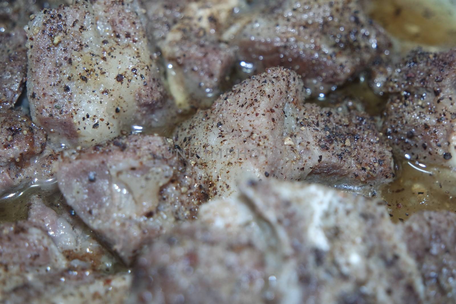 Top view of siri paaye or paya dish garnished with diced ginger, long coriander and black pepper. This dish is popular in Pakistan and Bangladesh