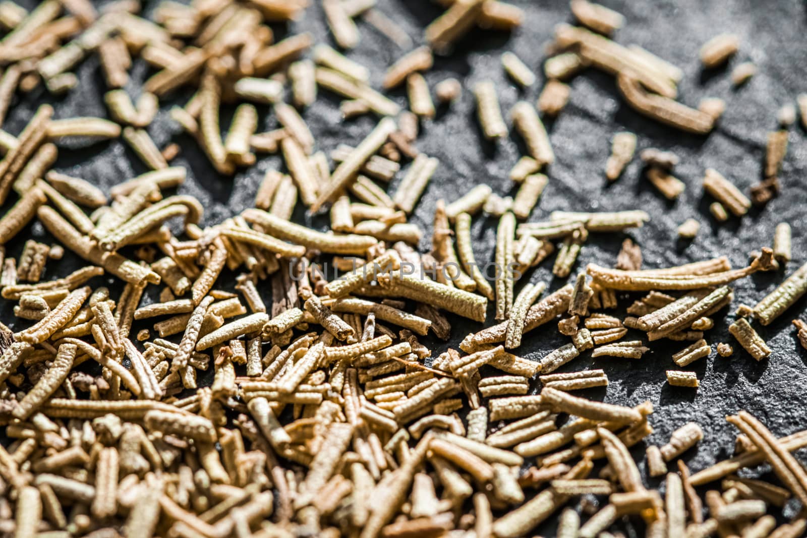 Rosemary closeup on luxury stone background as flat lay, dry food spices and recipe ingredients