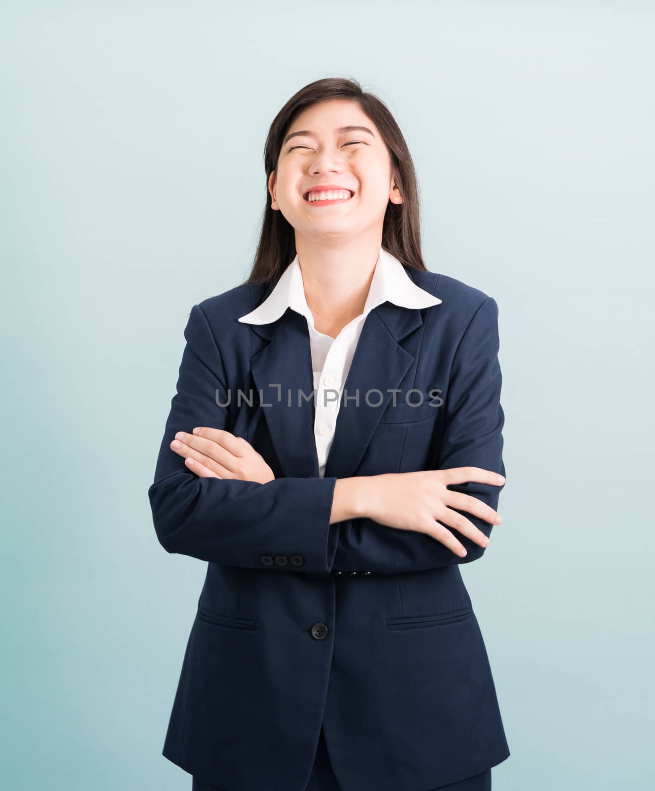 Teenage girl long hair is standing with her arms crossed by stoonn