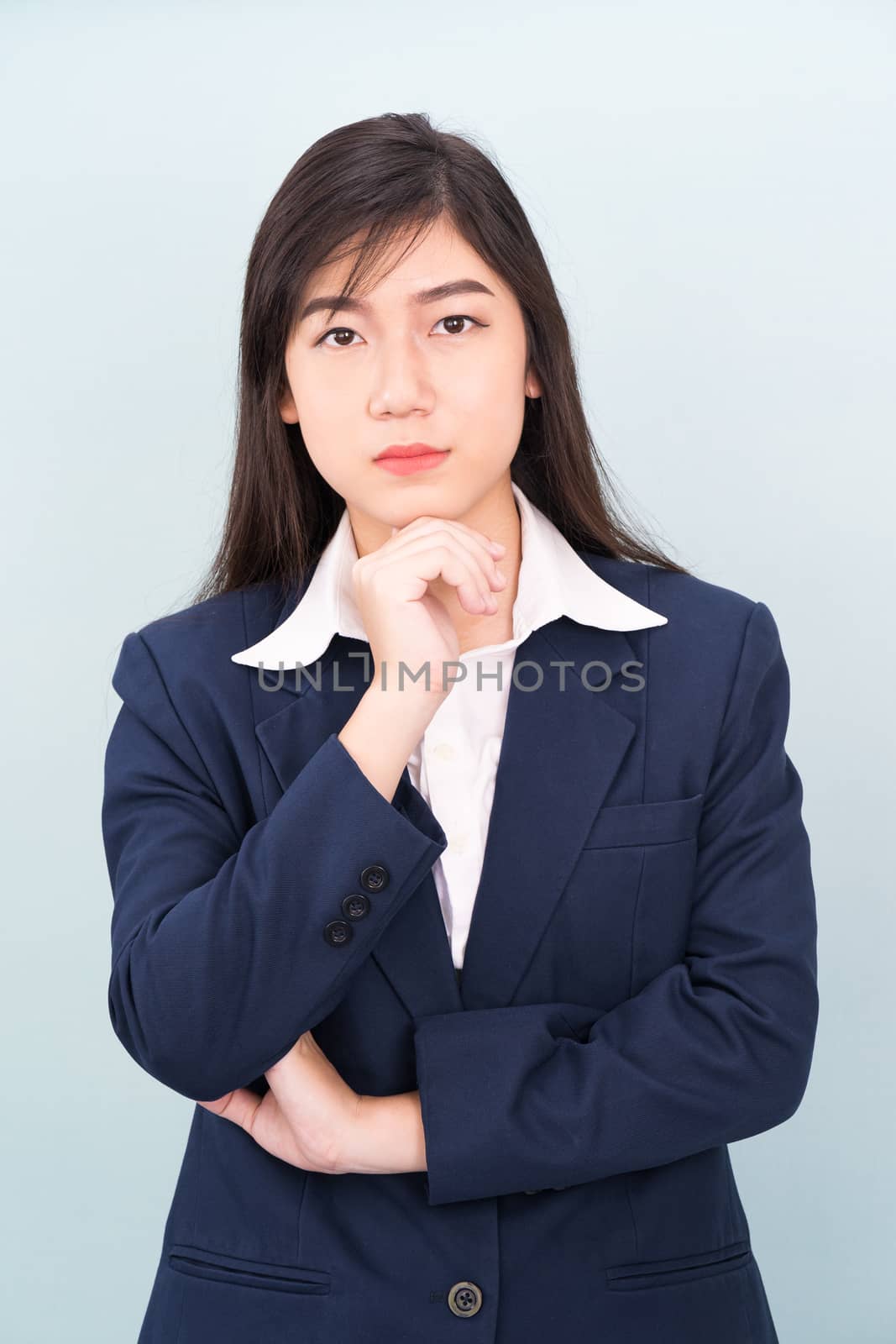 Teenage young girl wearing suit with hand on chin by stoonn