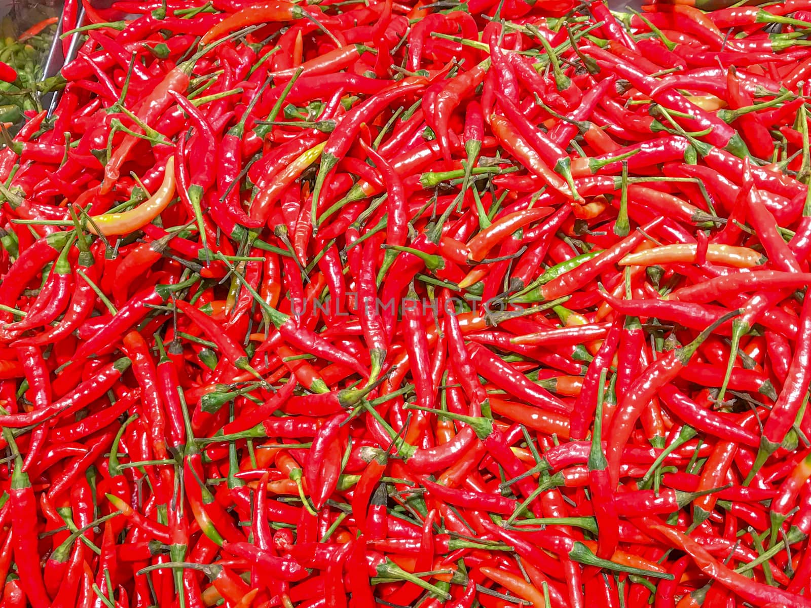 Closeup a pile of fresh chilli in a supermarket.