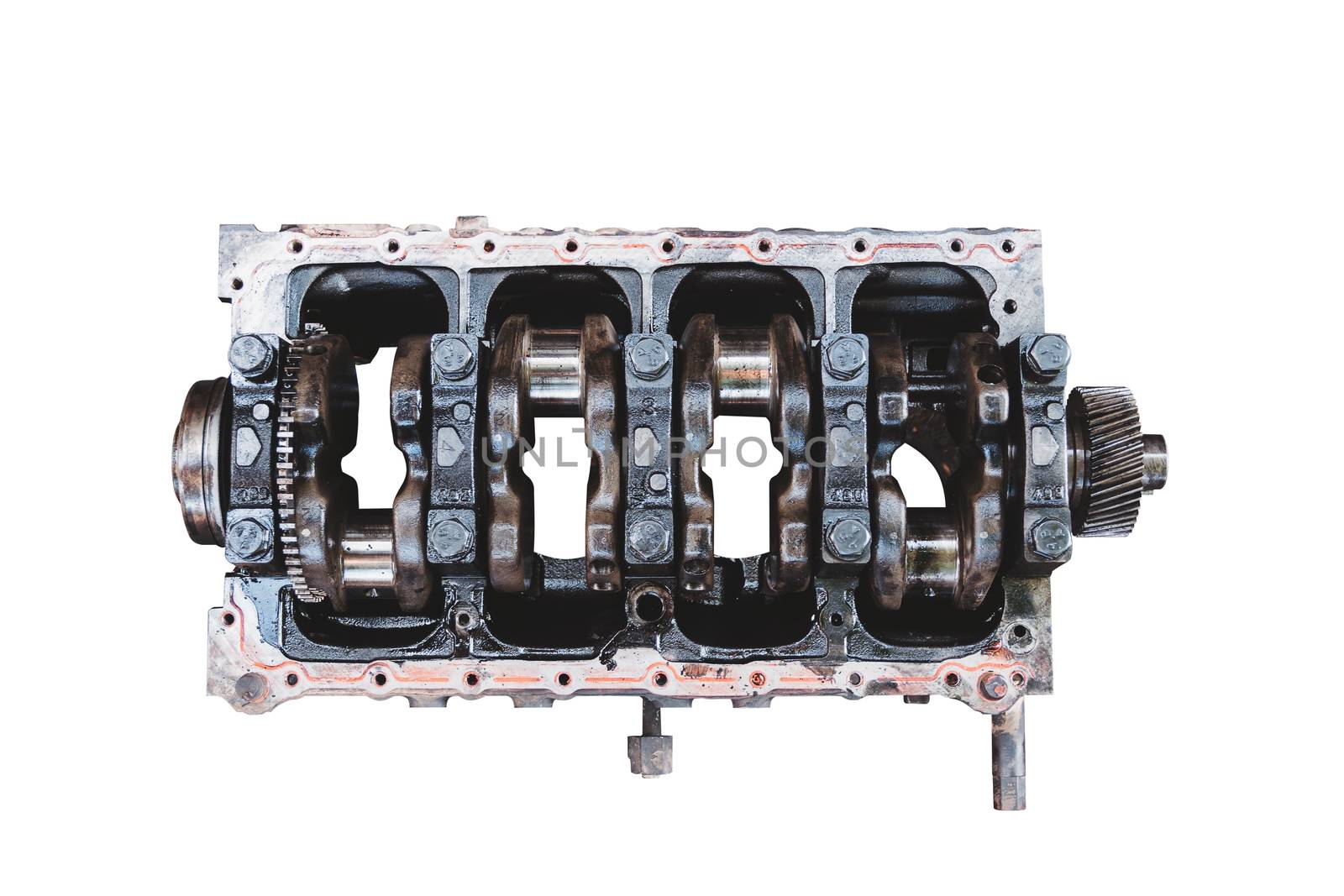 Closeup of the engine parts of a car that has been removed for overhaul isolated on white background, with clipping path, transportation and insurance industry concepts.