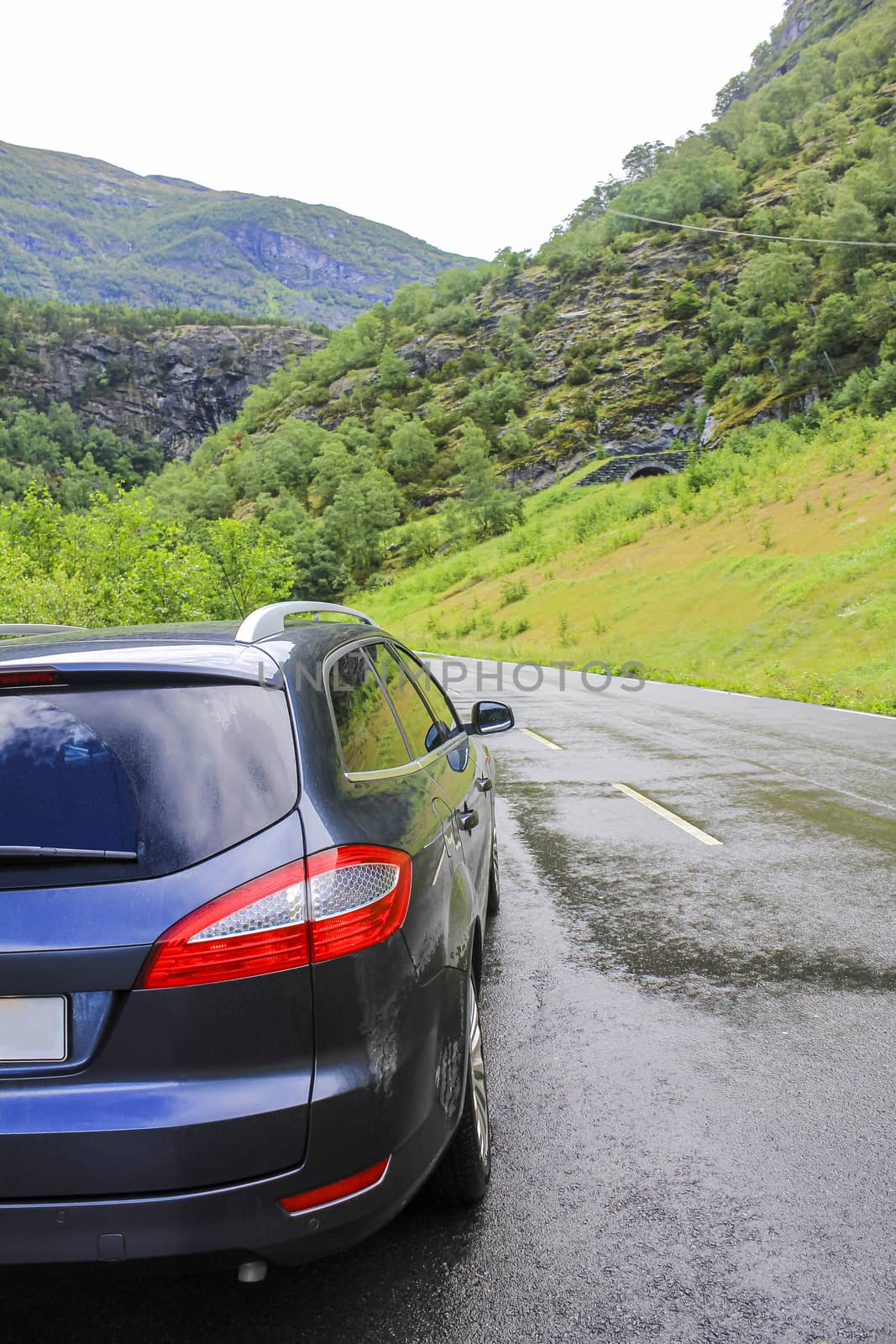 Car is driving on wet road the mountains of Hemsedal in Viken, Norway.