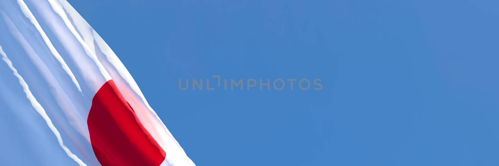 3D rendering of the national flag of Japan waving in the wind against a blue sky