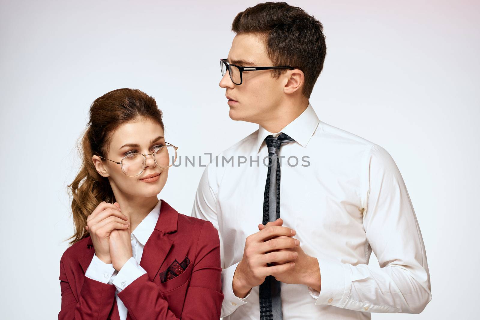 man and woman work colleagues officials communication light background. High quality photo