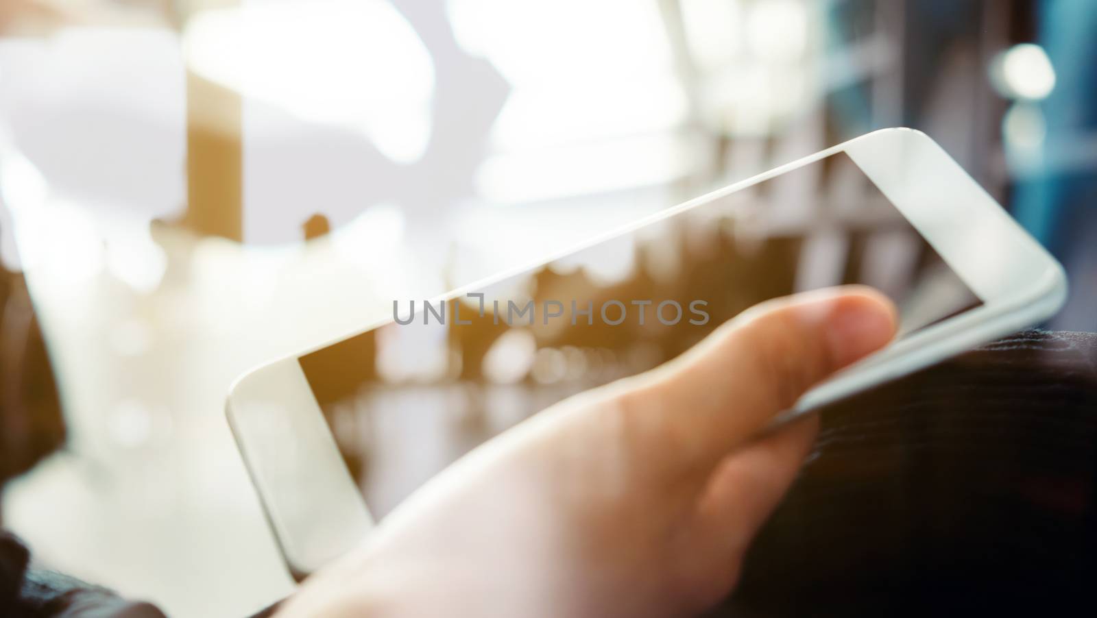 Closeup Image of Women Hand holding a smartphone