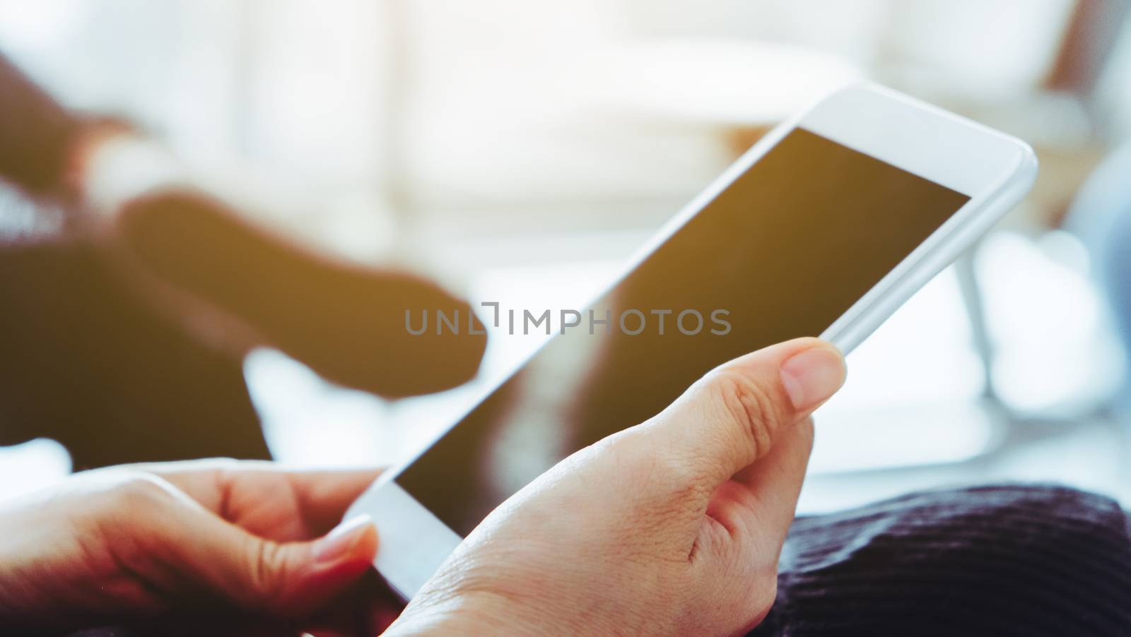 Closeup Image of Women Hand holding a smartphone