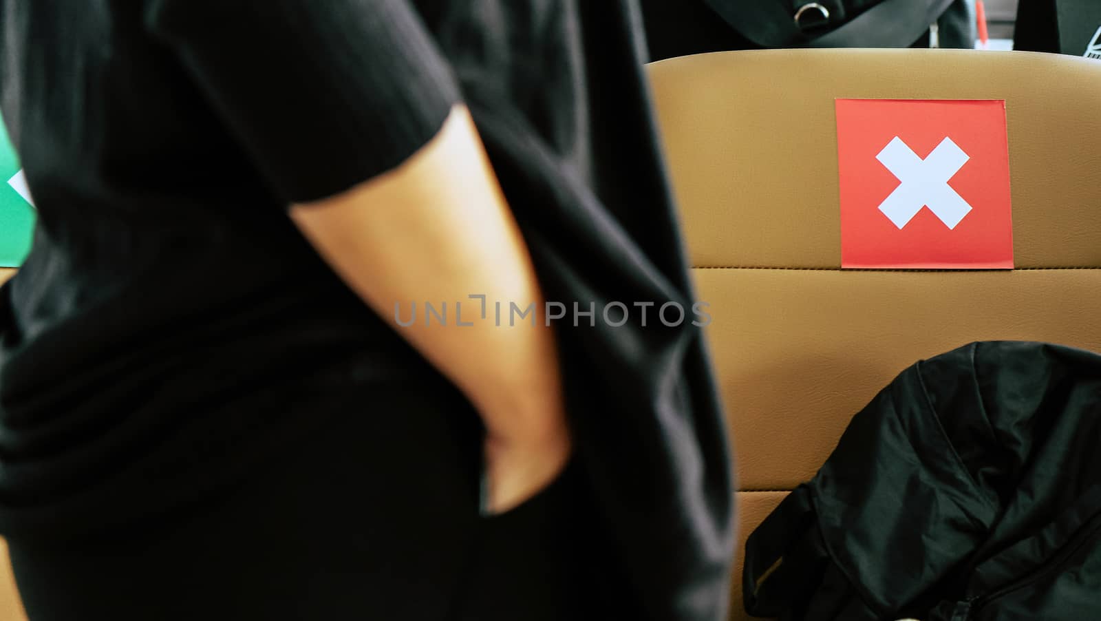 Social distancing, Rows of empty chairs in an airport's departure area marked with symbols regarding social distancing protocol to prevent the spreading of novel corona virus, COVID-19 in Thailand