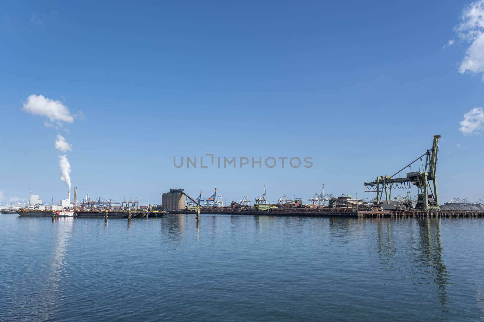 Netherlands, Rotterdam. Coal terminal wih big industrial cranes for handling coal transportation on the Maasvlakte in the port of Rotterdam