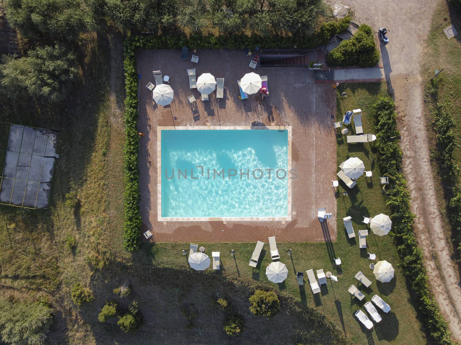 Aerial view of swimming pool with shower outdoors. Beautiful pool with clear water as texture background concept. Top view.