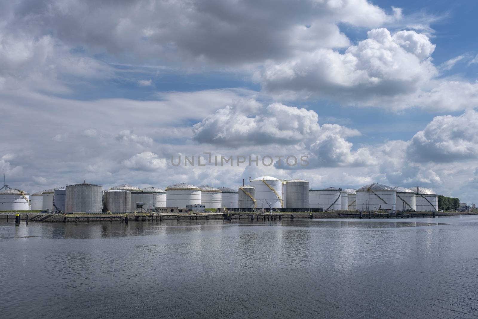 Tanker and oil storage tanks in Rotterdam, Netherlands. The port is the largest in Europe and facilitate the needs of a hinterland by Tjeerdkruse