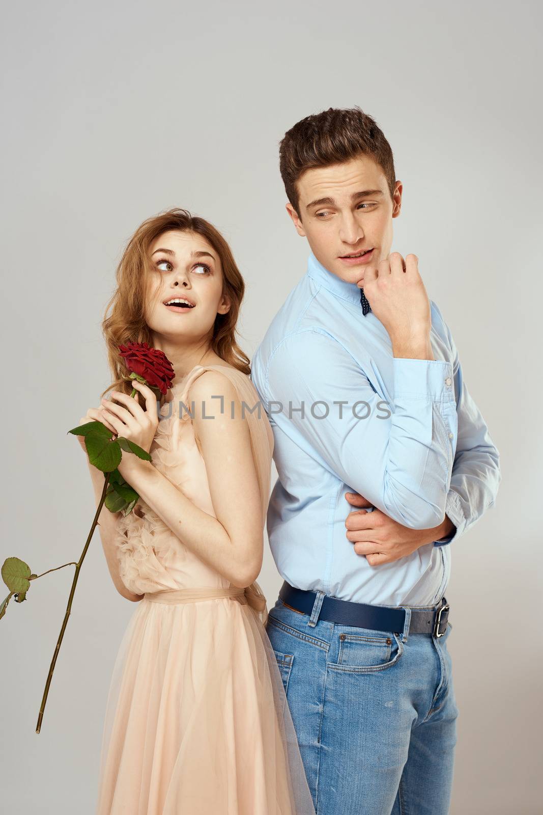 beautiful couple relationship rose gift as romance hug light background. High quality photo