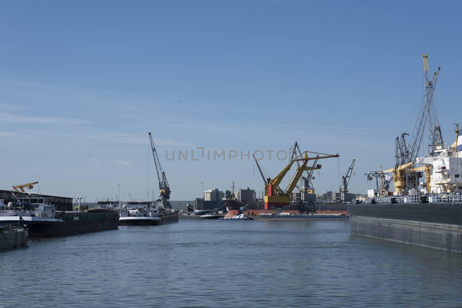 Logistics and transportation of Container Cargo ship and Cargo plane with working crane bridge in shipyard, logistic import export and transport industry background