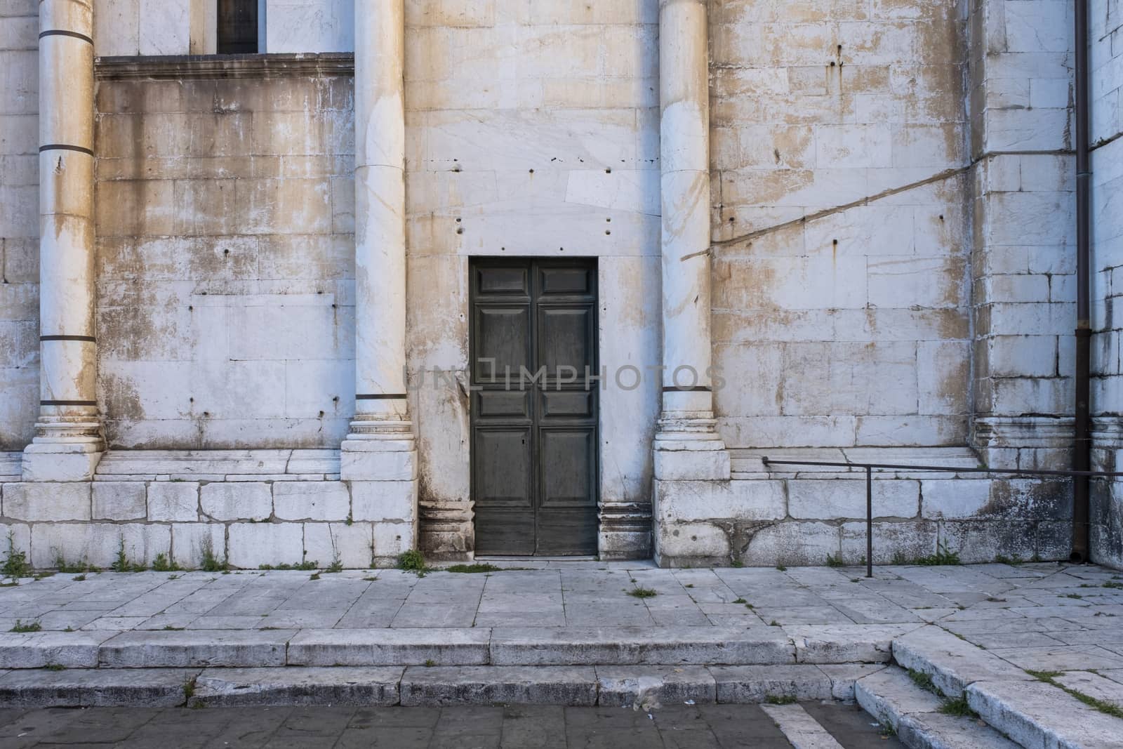 Door in an old gothic stone building in summertime