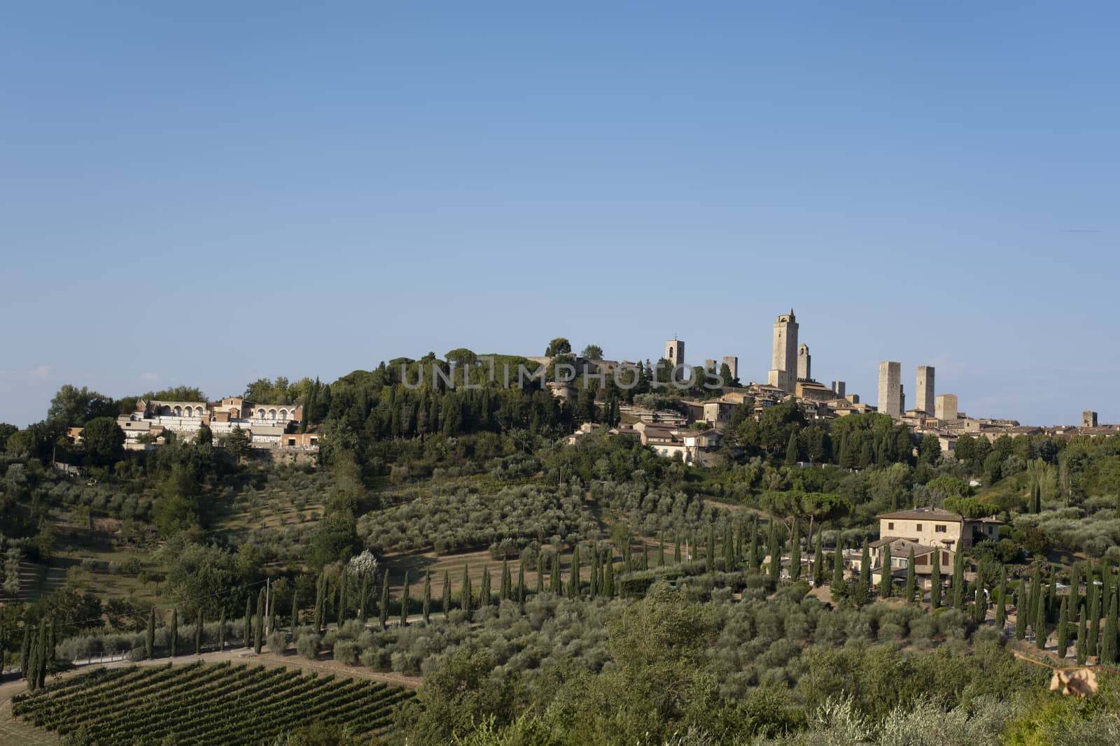 The medieval skyline of San Gimignano. Siena, Italy. by Tjeerdkruse