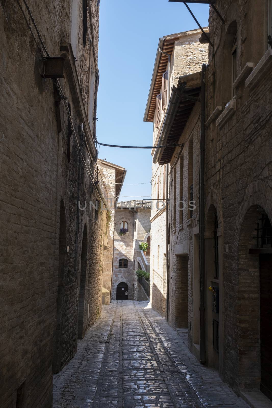 typical Italian street in a small provincial town of Tuscan, Italy, Europe by Tjeerdkruse