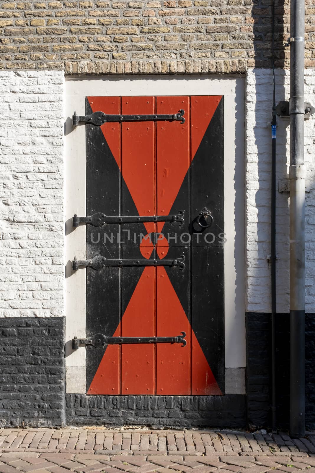 Beautiful old wooden door with iron ornaments in a medieval castle by Tjeerdkruse