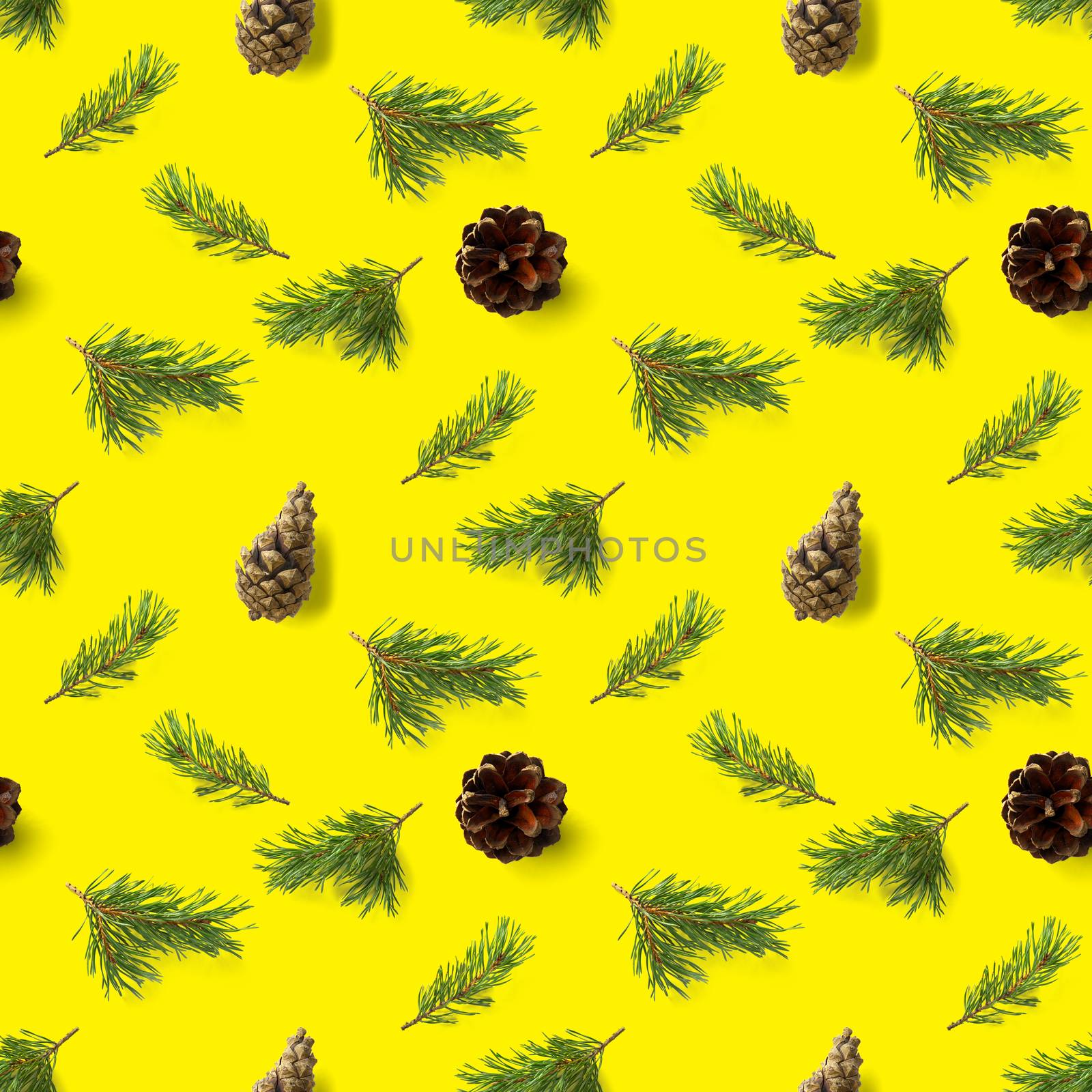 christmas seamless pattern from Pine cones, pine twig, needles on yellow background. modern pine cone christmas collage. Print for paper, fabric, wallpaper or background made frome pinecones.