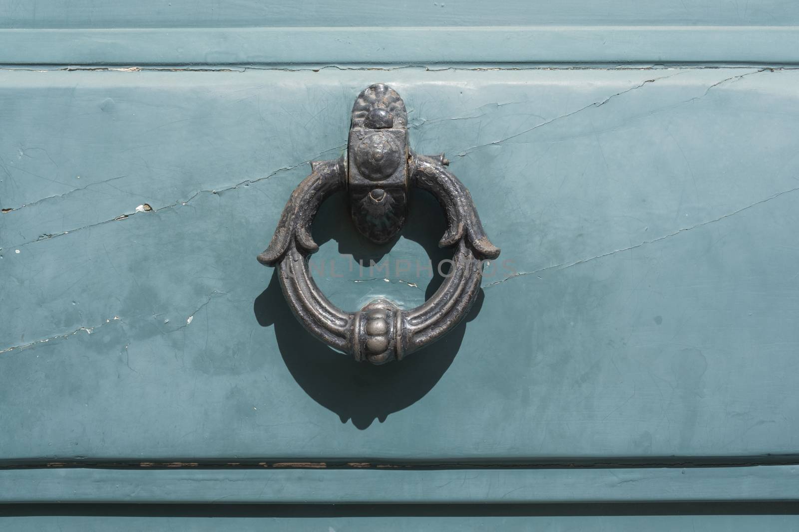 Vintage image of ancient door knocker on a wooden door. by Tjeerdkruse